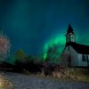 Church bathed in Northern lights